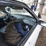 
              FILE - The body of a victim is seen in a damaged car in Almaty, Kazakhstan, Friday, Jan. 7, 2022. The government, by then led by Nazarbayev's close ally Tokayev, responded with a deadly clampdown, culminating in a "shoot-to-kill" order as the president blamed "terrorists" allegedly funded and trained from abroad. ​(AP Photo/Vasily Krestyaninov, File)
            