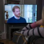 
              A person at home in Edinburgh watches Prince Harry, the Duke of Sussex, being interviewed by ITV's Tom Bradby during "Harry: The Interview," two days before his controversial autobiography "Spare" is published, Sunday, Jan. 8, 2023. (Jane Barlow/PA via AP)
            