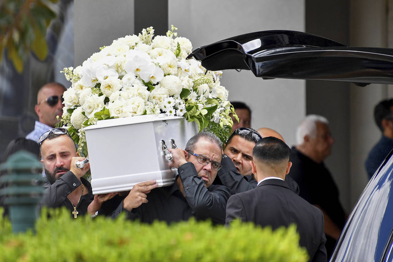 The casket of Vanessa Tadros is carried during her funeral in Sydney, Monday, Jan. 16, 2023. Tadros...