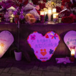 
              Signs in English, Chinese and Spanish express condolences at a growing memorial for victims of Monday's mass shooting in Half Moon Bay, Calif., on Wednesday, Jan. 25, 2023. Several memorials have been left in town and at the sites where the farmworkers were killed. (Carlos Avila Gonzalez/San Francisco Chronicle via AP)
            