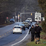 
              Members of a State Police K-9 unit search on Chief Justice Cushing Highway in Cohasset, Mass., Jan. 7, 2022. Authorities say the husband of a missing Massachusetts woman has been arrested for allegedly misleading investigators. Cohasset police and Massachusetts State Police on Sunday took Brian Walshe, 46, of Cohasset, Mass., into custody. His arrest comes after state and local police suspended their ground search for 39-year-old Ana Walshe, who has been missing since New Year’s Day. (Craig F. Walker/The Boston Globe via AP)
            