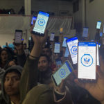 
              Migrants hold up their phones showing the CBPOne app at a shelter Sunday, Jan 22, 2023, in Tijuana, Mexico. A mobile app for migrants to seek asylum in the United States has been oversaturated since it was introduced this month in one of several major changes to the government's response to unprecedented migration flows. Hoping to get lucky when a new appointments are made available daily, migrants are increasingly frustrated by a variety of error messages. (AP Photo/Elliot Spagat)
            