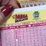 
              A Mega Millions entry card is displayed at the Cranberry Super Mini Mart in Cranberry, Pa., Thursday, Jan. 12, 2023. With no grand prize winner named in the pervious 25 drawings, the Mega Millions jackpot is now at $1.35 billion, making it one of the largest jackpots in lottery history. The next drawing will be held Friday. (AP Photo/Gene J. Puskar)
            