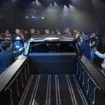 
              People look inside the Ram 1500 Revolution electric battery powered pickup truck after the Stellantis keynote at the CES tech show Thursday, Jan. 5, 2023, in Las Vegas. (AP Photo/John Locher)
            