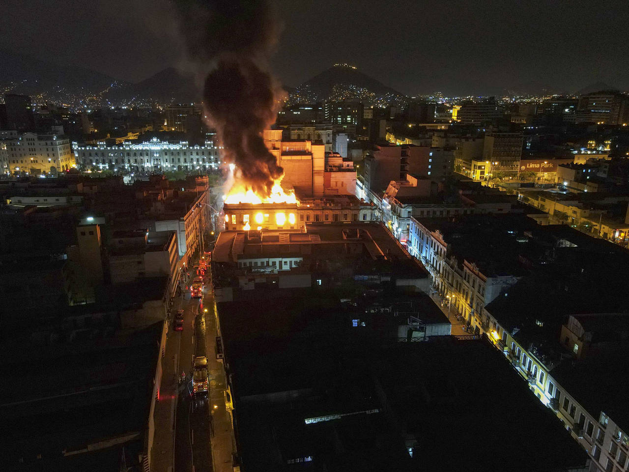 A building burns amid anti-government protests in downtown Lima, Peru, Thursday, Jan. 19, 2023. Pro...