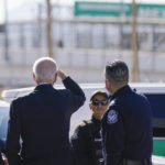 
              President Joe Biden, second from left, looks towards a large "Welcome to Mexico" sign that is hung over the Bridge of the Americas as he tours the El Paso port of entry, a busy port of entry along the U.S.-Mexico border, in El Paso Texas, Sunday, Jan. 8, 2023. (AP Photo/Andrew Harnik)
            