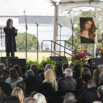
              Priscilla Presley reads a poem wrtitten by granddaughter Harper Lockwood during a memorial service for her daughter Lisa Marie Presley at Graceland Sunday, Jan. 22, 2023, in Memphis, Tenn. Lisa Marie died Jan. 12 after being hospitalized for a medical emergency and was buried on the property next to her son Benjamin Keough, and near her father Elvis Presley and his two parents. (AP Photo/John Amis)
            