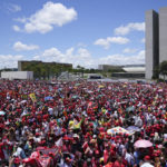 
              Supporters of Luiz Inacio Lula da Silva gather to attend his inauguration as new president outside the Planalto presidential palace in Brasilia, Brazil, Sunday, Jan. 1, 2023. (AP Photo/Silvia Izquierdo)
            