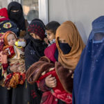 
              Mothers along with babies who suffer from malnutrition wait to receive help and check-up at a clinic that run by the WFP, in Kabul, Afghanistan, Thursday, Jan. 26, 2023. A spokesman for the U.N. food agency says malnutrition rates in Afghanistan are at record highs. Aid agencies have been providing food, education, healthcare and other critical support to people, but distribution has been severely impacted by a Taliban edict banning women from working at national and international nongovernmental groups. (AP Photo/Ebrahim Noroozi)
            