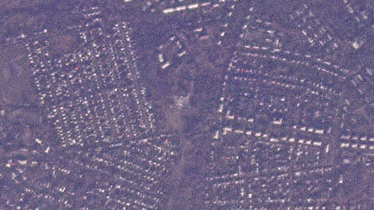 This satellite photo from Planet Labs PBC shows the remains of a vocational school in the Russian-o...
