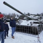 
              People visit an exhibition of tanks and APCs of Ukrainian armed forces damaged and captured during the fighting at an exhibition at the museum "Breakthrough of the Siege of Leningrad" in Kirovsk, about 30 kilometres (19 miles) east of St. Petersburg, Russia, Sunday, Jan. 22, 2023. (AP Photo/Dmitri Lovetsky)
            