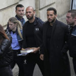 
              Andrew Tate, third right, and his brother Tristan, second right, are brought by police officers to the Court of Appeal, in Bucharest, Romania, Tuesday, Jan.10, 2023. Andrew Tate, a divisive social media personality and former professional kickboxer, was detained last month in Romania on charges of human trafficking and rape, and later arrested for 30 days after a court decision. (AP Photo/Vadim Ghirda)
            
