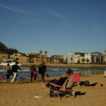 
              People visit La Concha beach on a winter day in San Sebastian, northern Spain, Wednesday, Jan. 4, 2023. (AP Photo/Alvaro Barrientos)
            