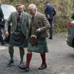 
              Britain's King Charles III, right, arrives to visit the Aboyne and Mid Deeside Community Shed to meet with local hardship support groups and tour the new facilities, in Aboyne, Aberdeenshire, Scotland, Thursday, Jan. 12, 2023.  (Andrew Milligan/Pool Photo via AP)
            