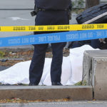 
              FILE - A paramedic looks at a body covered under a white sheet along a bike path, Oct. 31, 2017, in New York. Sayfullo Saipov, an Islamic extremist who killed eight in a New York bike path attack was convicted of federal crimes on Thursday, Jan. 26 2023, and could face the death penalty. (AP Photo/Bebeto Matthews, File)
            