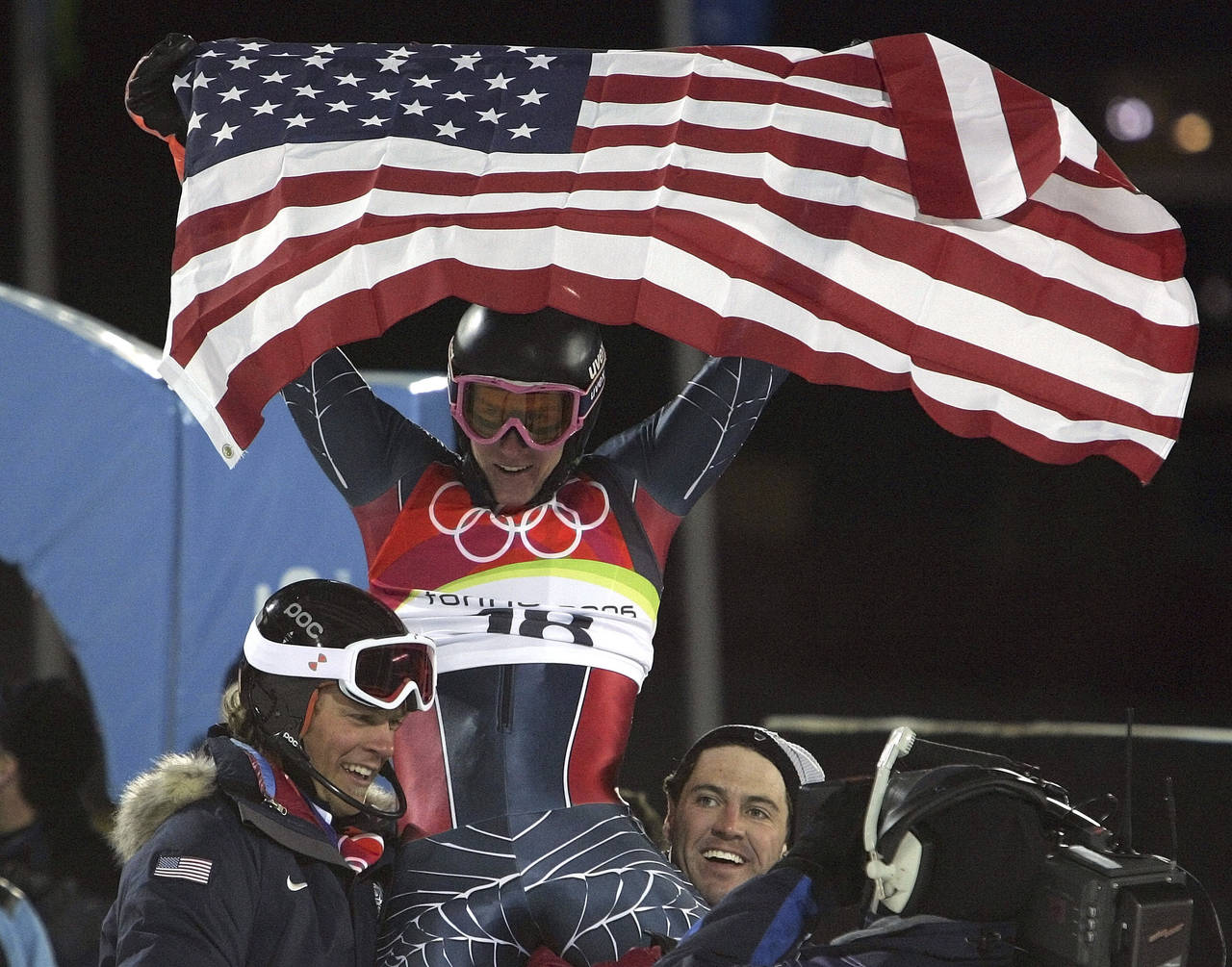 FILE - Ted Ligety of the United States, center, is chaired by teammates as he celebrates after winn...