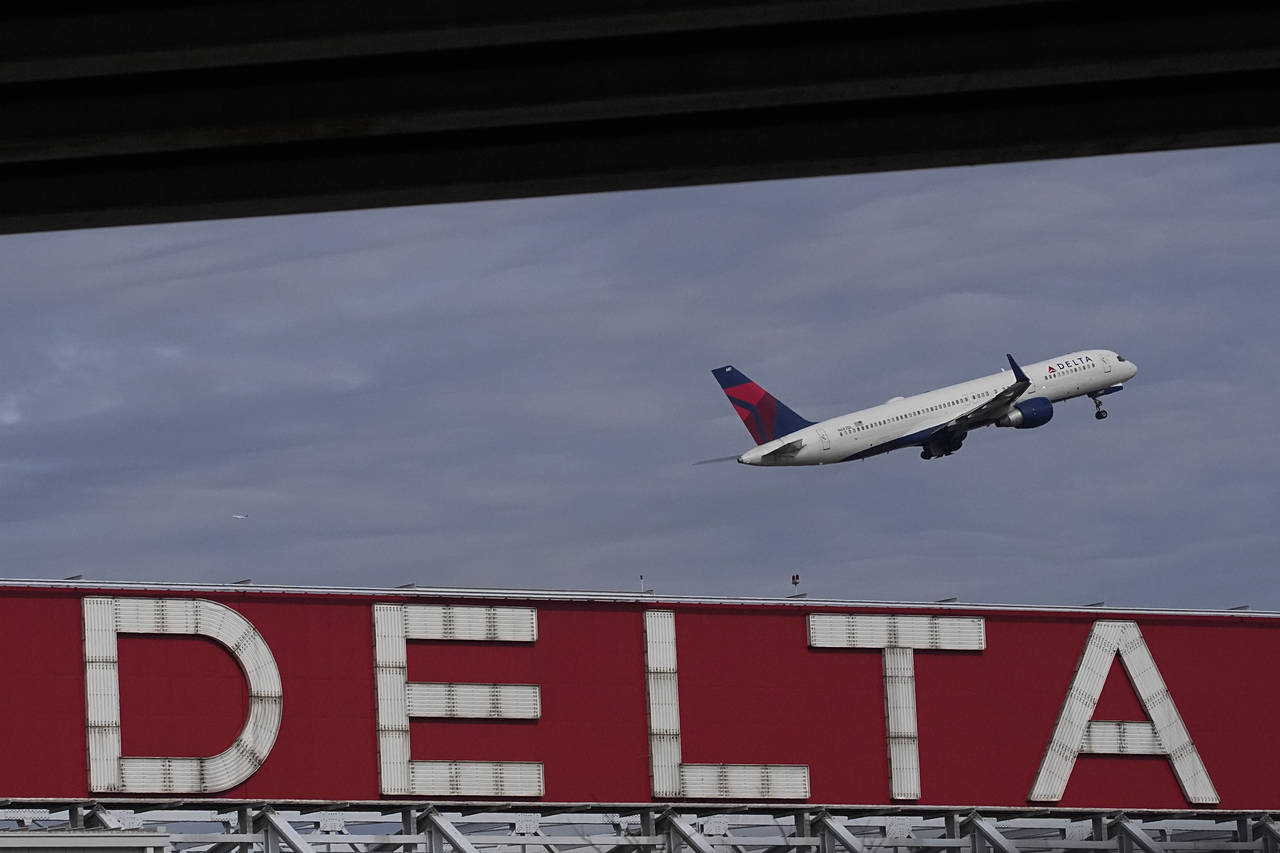 FILE - A Delta Air Lines plane takes off from Hartsfield-Jackson Atlanta International Airport in A...