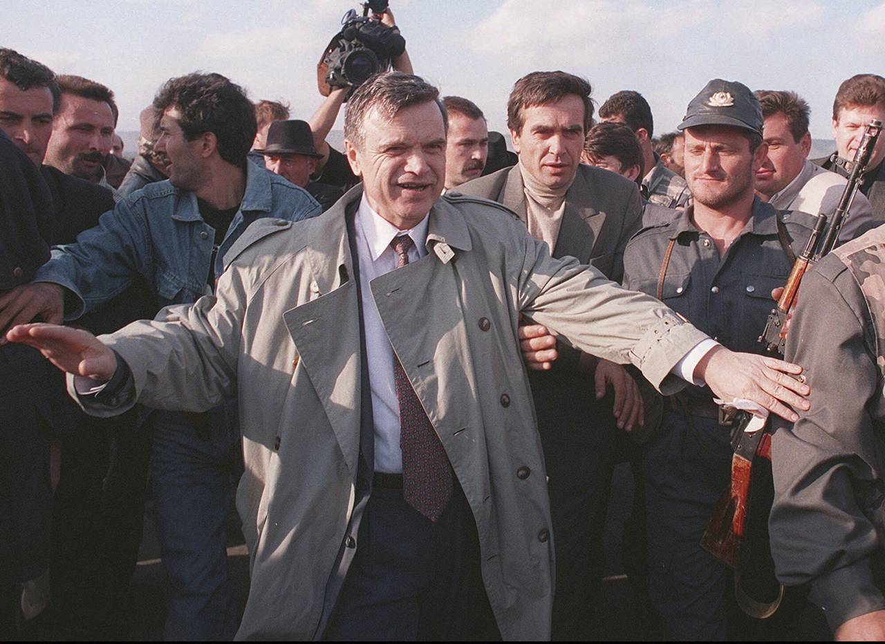 FILE - The former speaker of Russia's parliament Ruslan Khasbulatov makes his way through a crowd o...