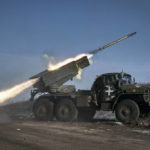 
              Ukrainian army Grad multiple rocket launcher fires rockets at Russian positions in the frontline near Soledar, Donetsk region, Ukraine, Wednesday, Jan. 11, 2023. (AP Photo/Libkos)
            