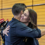 
              New Zealand Prime Minister Jacinda Ardern, right, hugs her fiancee Clark Gayford after announcing her resignation at a press conference in Napier, New Zealand, Thursday, Jan. 19, 2023. Fighting back tears, Ardern told reporters that Feb. 7 will be her last day in office. (Mark MItchell/New Zealand Herald via AP)
            