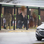 
              Parents escort their children Richneck Elementary School on Monday Jan. 30, 2023 in Newport News, Va.  The Virginia elementary school where a 6-year-old boy shot his teacher has reopened with stepped-up security and a new administrator. (AP Photo/John C. Clark)
            