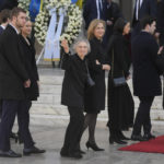 
              Greece's former princess Irene, center, sister of former king of Greece Constantine II arrives at Metropolitan Cathedral for the funeral in Athens, Monday, Jan. 16, 2023. Constantine died in a hospital late Tuesday at the age of 82 as Greece's monarchy was definitively abolished in a referendum in December 1974. (AP Photo/Petros Giannakouris)
            