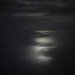 
              Moonlight is reflected along the surface of a fjord during the polar night in Norway, Friday, Jan. 6, 2023. "First time in Svalbard, it was like coming to the moon," said the Rev. Leif Magne Helgesen, who spent a dozen years in the main village of Longyearbyen as the pastor of its only church, Svalbard Kirke. (AP Photo/Daniel Cole)
            
