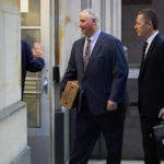 
              CORRECTS THAT PLANTS ARE FORMERLY OWNED BY FIRSTENERGY -  Former Ohio House Speaker Larry Householder, center, walks into Potter Stewart U.S. Courthouse with his attorneys, Mark Marein, left, and Steven Bradley, right, before jury selection in his federal trial, Friday, Jan. 20, 2023, in Cincinnati. Householder and former Ohio Republican Party chair Matt Borges are charged with racketeering in an alleged $60 million scheme to pass state legislation to secure a $1 billion bailout for two nuclear power plants formerly owned by Akron, Ohio-based FirstEnergy. Householder and Borges have both pleaded not guilty. (AP Photo/Joshua A. Bickel)
            
