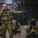 Commander of the Ukrainian army, Col. Gen. Oleksandr Syrskyi, gives instructions in a shelter in Soledar, the site of heavy battles with the Russian forces, in the Donetsk region, Ukraine, Sunday, Jan. 8, 2023. (AP Photo/Roman Chop)