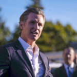 
              California Gov. Gavin Newsom speaks Tuesday, Jan. 24, 2023, at the I.D.E.S. Portuguese Hall in Half Moon Bay, Calif., with victims' families, local leaders and community members that were impacted by the devastating shootings the day before. (AP Photo/ Aaron Kehoe)
            