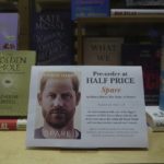 
              A promotional poster of the new book "Spare"is displayed in a bookstore in London, Thursday, Jan. 5, 2023. Prince Harry alleges in a much-anticipated new memoir that his brother Prince William lashed out and physically attacked him during a furious argument over the brothers' deteriorating relationship, The Guardian reported Thursday. The newspaper said it obtained an advance copy of the book, "Spare," due to be published next week. (AP Photo/Kin Cheung)
            