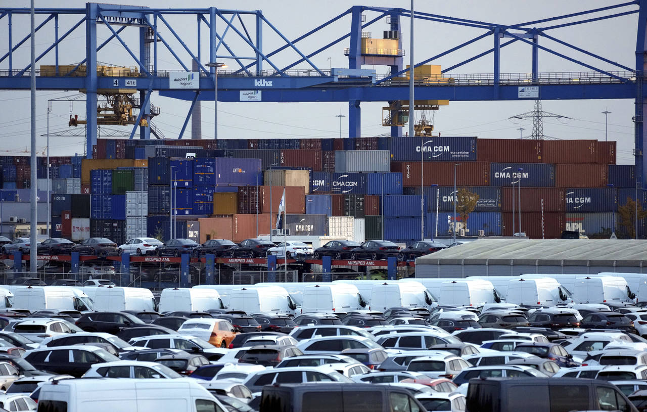 FILE -- Cars and containers are pictured at the 'duisport logport' logistics center at the river Rh...