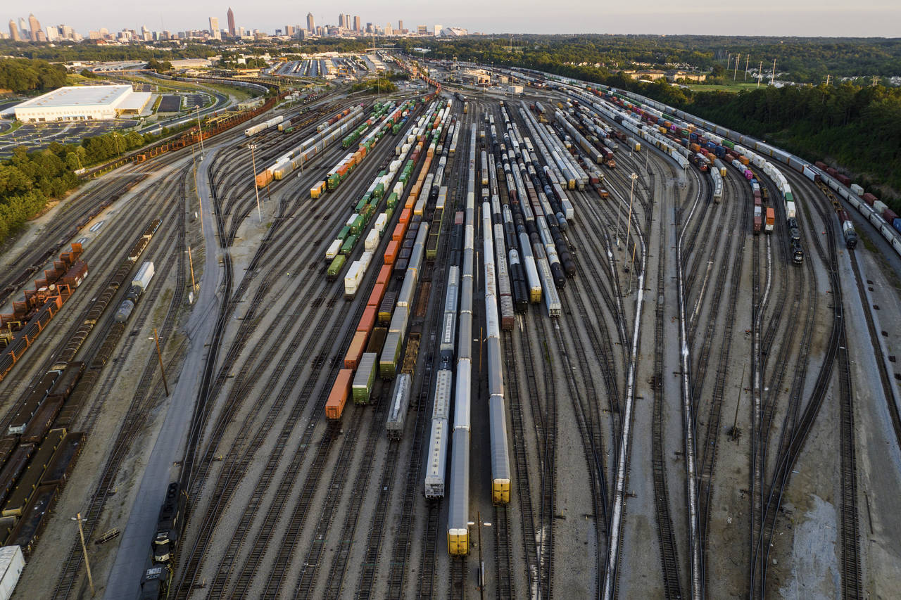 FILE - Freight train cars sit in a Norfolk Southern rail yard on Sept. 14, 2022, in Atlanta. Norfol...