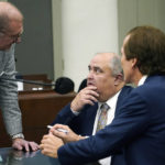 
              FILE - John Davis, former director of the Mississippi Department of Human Services, confers with defense attorneys Merrida Coxwell, right, and Charles Mullins, left, in Jackson, Miss., on Sept. 22, 2022. Davis pleaded guilty to state and federal charges in a conspiracy to misspend tens of millions of dollars that were intended to help needy families in one of the poorest states in the U.S. as part of the largest public corruption case in Mississippi history. (AP Photo/Rogelio V. Solis, File)
            