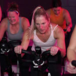 
              Deb Figulski participates in a spin class at Fuel Training Studio, Thursday, Jan. 19, 2023, in Newburyport, Mass. Gyms and fitness studios were among the hardest hit businesses during the pandemic. But for gyms who made it through the worst, signs of stability are afoot.  (AP Photo/Mary Schwalm)
            