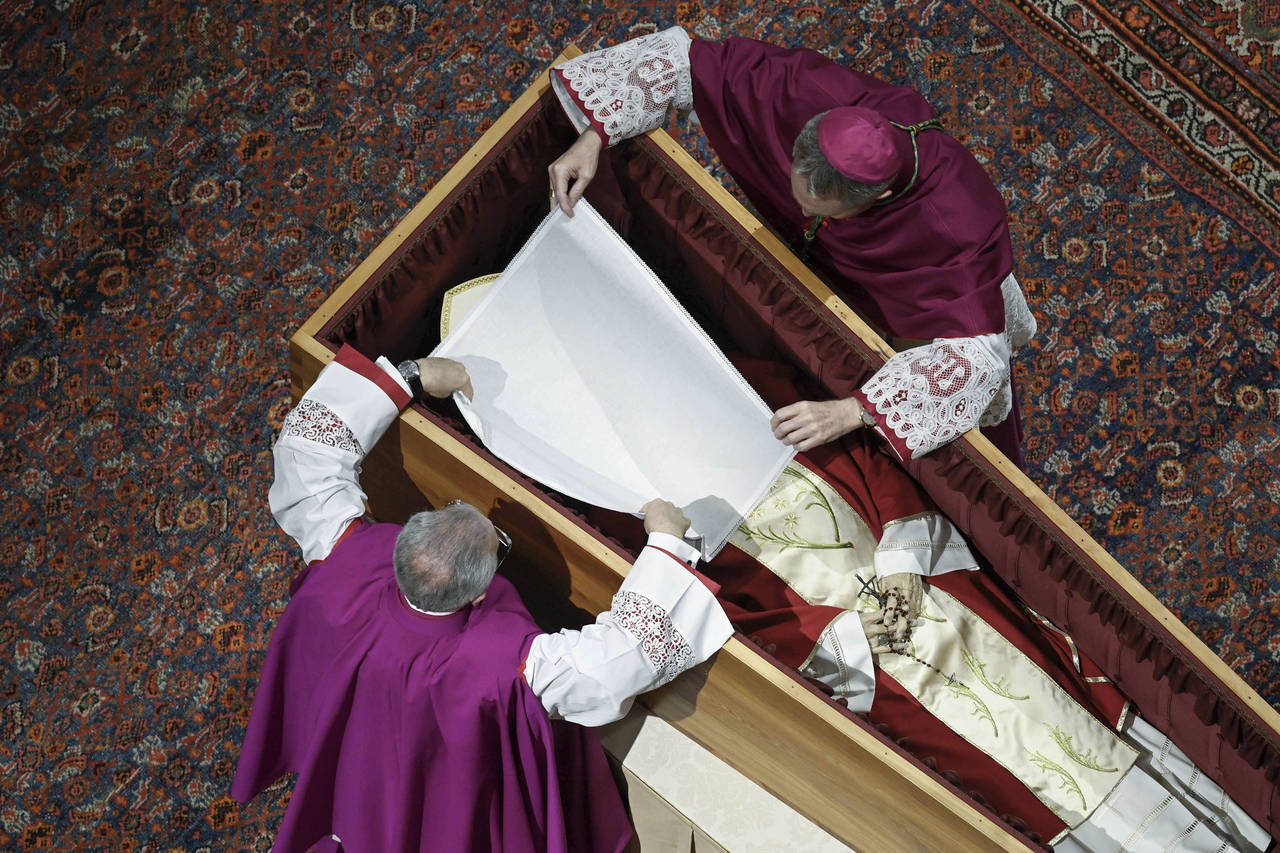 In this image released on Thursday, Jan. 5, 2023, by the Vatican Media news service, Bishops Georg ...