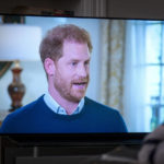 
              A person at home in Edinburgh watches Prince Harry, the Duke of Sussex, being interviewed by ITV's Tom Bradby, during "Harry: The Interview," two days before his controversial autobiography "Spare" is published, Sunday, Jan. 8, 2023. (Jane Barlow/PA via AP)
            