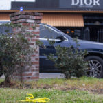 
              A small section of police tape remains on the scene where nine people were injured following an overnight shooting at the Dior Bar & Lounge in Baton Rouge, La., on Sunday, Jan. 22, 2023. (Michael Johnson/The Advocate via AP)
            