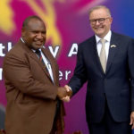 
              In this image from a video, Australian Prime Minister Anthony Albanese, left, and Papua New Guinea's Prime Minister James Marape shake hands outside the parliament in Port Moresby, Papua New Guinea Thursday, Jan. 12, 2023. The leaders of Australia and neighboring Papua New Guinea said Thursday they are finalizing a new security treaty, a move that comes as a challenge to China's growing assertiveness in the region. (Australia Pool via AP)
            