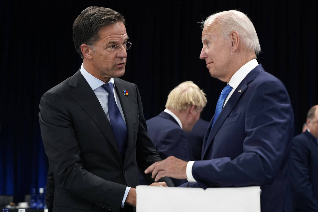 FILE - Netherland's Prime Minister Mark Rutte, left, speaks with U.S. President Joe Biden during a ...