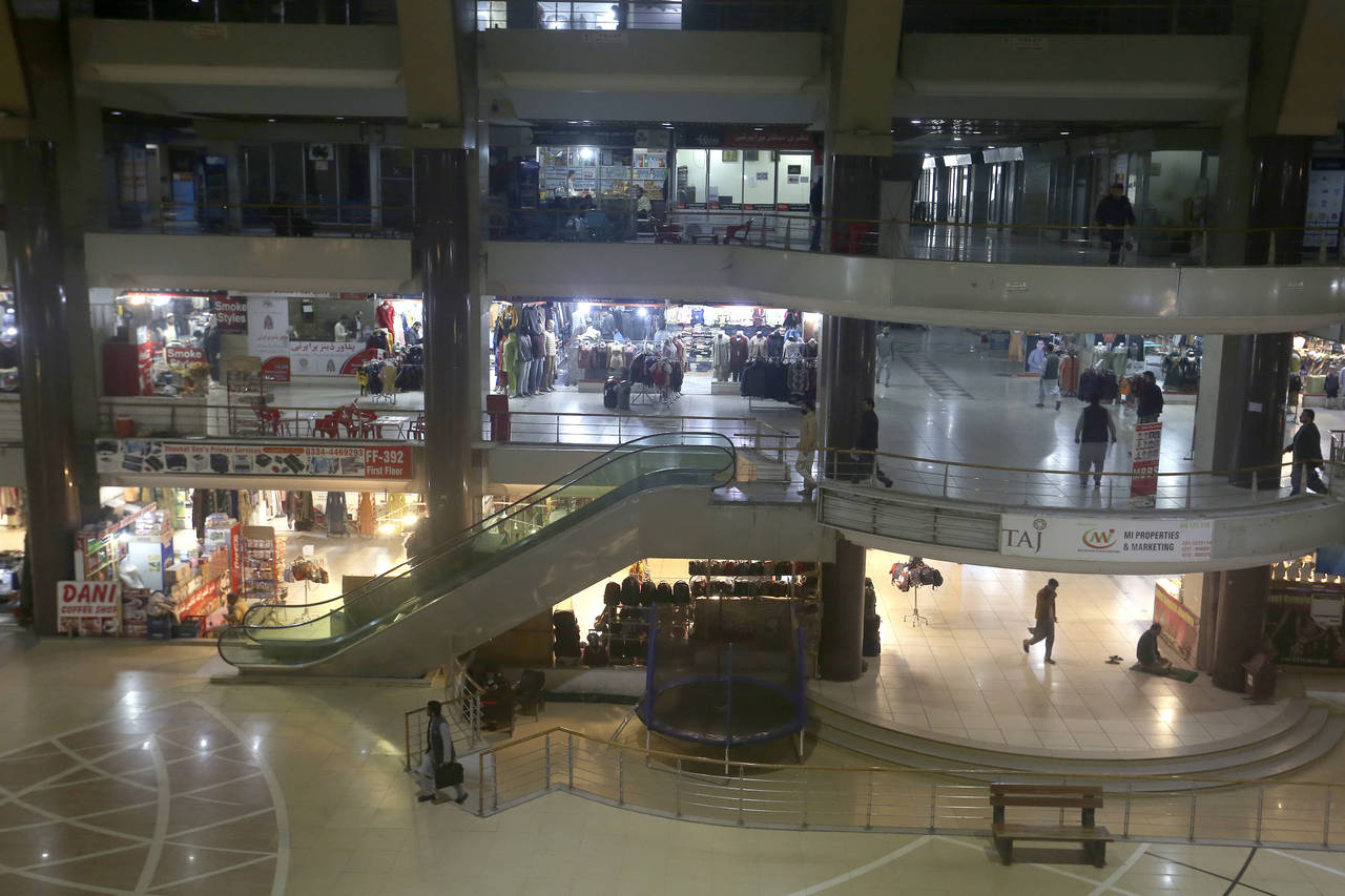 People visit a shopping mall in Peshawar, Pakistan, Wednesday, Jan. 4, 2023. Authorities on Wednesd...