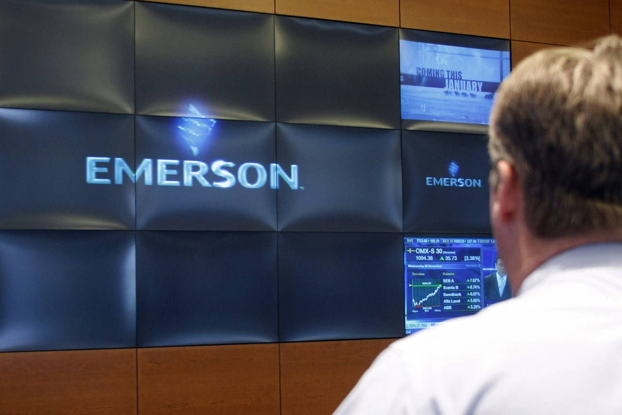 FILE - A visitor views the video wall in the lobby of Emerson Electric's headquarters building in S...