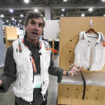 
              Eric Henderson, of Meteorite PR, wears the Safeback SBX and Db Snow Pro Vest at the the Outdoor Retailer trade show Tuesday, Jan. 10, 2023, in Salt Lake City. The Db Snow Pro Vest is a wearable avalanche safety layer for skiers and snowboarders. Integrating the Safeback SBX system into the vest provides user-friendly protection against suffocation for 90 minutes without the need for a mouthpiece during avalanche burial. (AP Photo/Rick Bowmer)
            