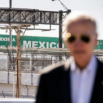 
              A large "Welcome to Mexico" sign hung over the Bridge of the Americas is visible as President Joe Biden talks with U.S. Customs and Border Protection officers as he tours the El Paso port of entry, a busy port of entry along the U.S.-Mexico border, in El Paso Texas, Sunday, Jan. 8, 2023. (AP Photo/Andrew Harnik)
            