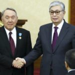 
              FILE - In this photo from Wednesday, March 20, 2019, the interim president of Kazakhstan, Kassym-Jomart Tokayev, right, shakes hands with outgoing President Nursultan Nazarbayev after an inauguration ceremony in Astana, Kazakhstan. Demonstrations broke out in the western part of the Central Asian country over an increase in state-controlled gas prices as 2022 began. Those soon spread and became broad criticisms of corruption, economic inequality and a continuing hold on politics and the country's energy wealth by Nazarbayev, the former Soviet country’s first leader, and his family. The unrest left over 200 dead and thousands detained. (AP Photo/File)
            