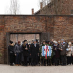 
              Holocaust survivors and former Auschwitz inmates attend a wreath lying ceremony in front of the Death Wall in the former Nazi German concentration and extermination camp Auschwitz during ceremonies marking the 78th anniversary of the liberation of the camp in Oswiecim, Poland, Friday, Jan. 27, 2023. (AP Photo/Michal Dyjuk)
            