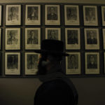 
              An orthodox Jew walks past the portraits of victims at the former Nazi German concentration and extermination camp Auschwitz-Birkenau in Oswiecim, Poland, Thursday, Jan. 26, 2023. Survivors of Auschwitz-Birkenau are gathering to commemorate the 78th anniversary of the liberation of the Nazi German death camp in the final months of World War II, amid horror that yet another war has shattered the peace in Europe. The camp was liberated by Soviet troops on Jan. 27, 1945. (AP Photo/Michal Dyjuk)
            