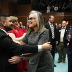 Arizona Democratic Gov. Katie Hobbs, right, gets a hug from Arizona House of Representatives Minority Leader Andrés Cano, D-Tucson, as Hobbs arrives to give the state of the state address at the Arizona Capitol in Phoenix, Monday, Jan. 9, 2023. (AP Photo/Ross D. Franklin)