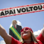 
              A supporter of Luiz Inacio Lula da Silva displays a sign reading in Portuguese ¨The Father Returned¨ prior to his inauguration as new president in Brasilia, Brazil, Sunday, Jan. 1, 2023. (AP Photo/Gustavo Moreno)
            