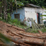 
              A resident stands outside her house after flooding triggered deadly landslides near Juquehy beach in Sao Sebastiao, Brazil, Monday, Feb. 20, 2023. (AP Photo/Andre Penner)
            
